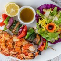 Grilled Shrimp · Grilled marinated jumbo shrimps with grilled vegetables on skewers. Served with green salad.