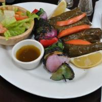 Salmon In Vine Leaves · Salmon wrapped in vine leaves, char-grilled to your taste.