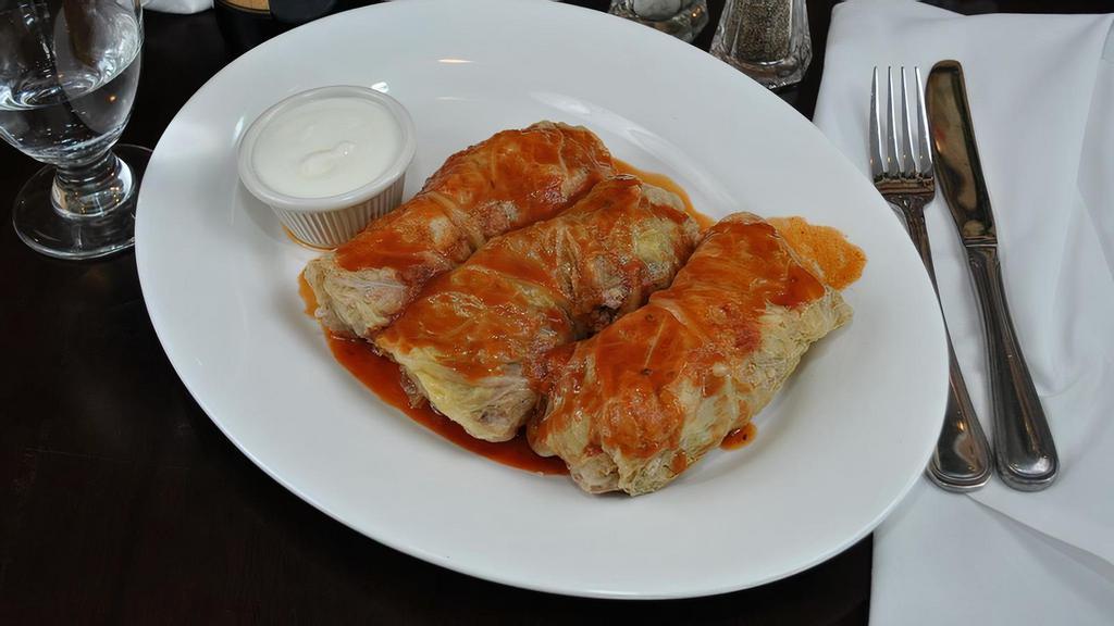  Stuffed Cabbage · Cabbage leaves stuffed with ground lamb and rice with yogurt.
