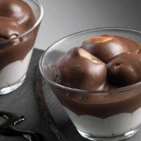 Profiterol · Cream puffs in vanilla and chocolate cream.