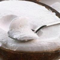 Coconut Sorbet · Coconut sorbet in natural shell.