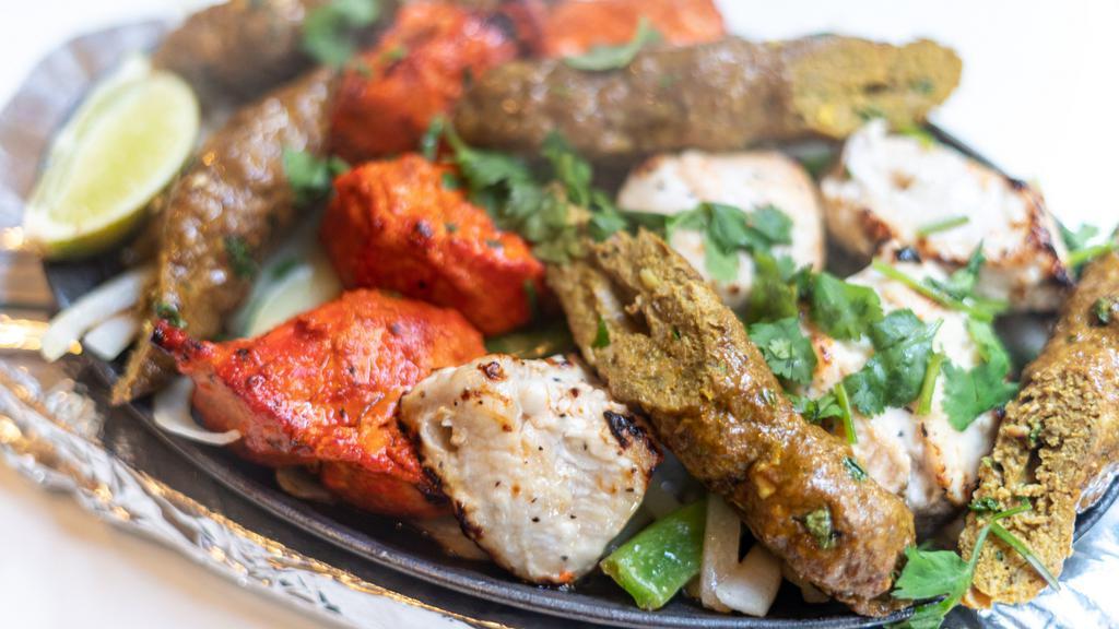 Tandoori Mixed Grill · Sheek kabab, malai kabab, tandoori chicken, and shrimp. Served with basmati rice.