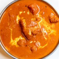 Butter Chicken · Clay oven cooked with butter, light cream, and tomato sauce. Server with basmati rice.