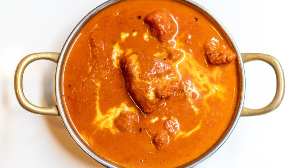 Butter Chicken · Clay oven cooked with butter, light cream, and tomato sauce. Server with basmati rice.
