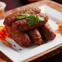 Akra Croquette · Malanga fritters (vegetable) seasoned with herbs and spices.