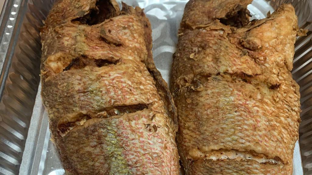 Pwasson Nan Sòs / Fish Créole · Whole Red Snapper seasoned in a blend of creole spices, served fried or stewed with pikiliz