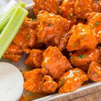Buffalo Mild Bone-In Wings · Served with celery or carrots, and blue cheese or ranch.