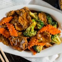 Broccoli Beef · Beef and broccoli tossed with carrots in brown sauce.