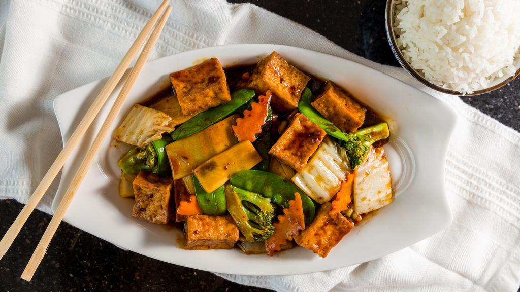 Tofu Family Style · Spicy. Lightly fried tofu with vegetables in spicy brown sauce.