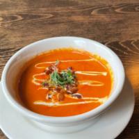 Freshly Made Tomato Soup · Made with tomatoes, onions, garlic, heavy cream, and salt and pepper.