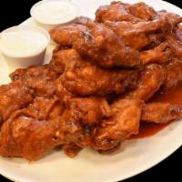 Fiery Buffalo Wings · Classic bone-in wings oven-baked, cooked to order perfectly crisp.