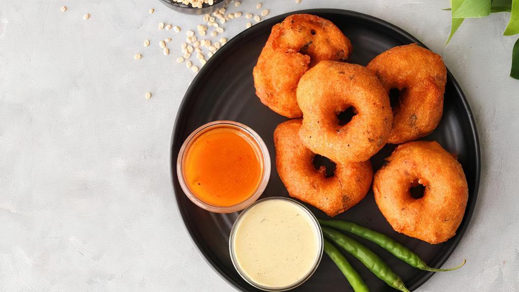 Masala Vada · Spiced & crunchy fritters made of bengal gram dal, served with sambar & coconut chutney.