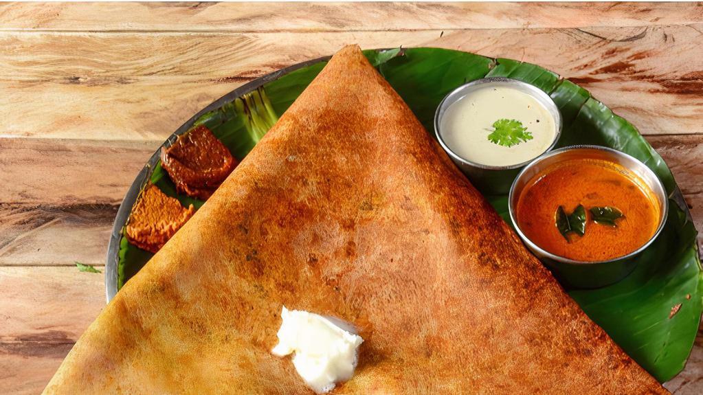 Butter Sada Dosai · Buttery, rice & lentil crepes, served with sambar, coconut & tomato chutney.