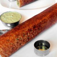 Pondicherry Masala Dosai · Pondicherry special rice and lentil crepe with onions, cabbage, green chilies & spicy sauce.