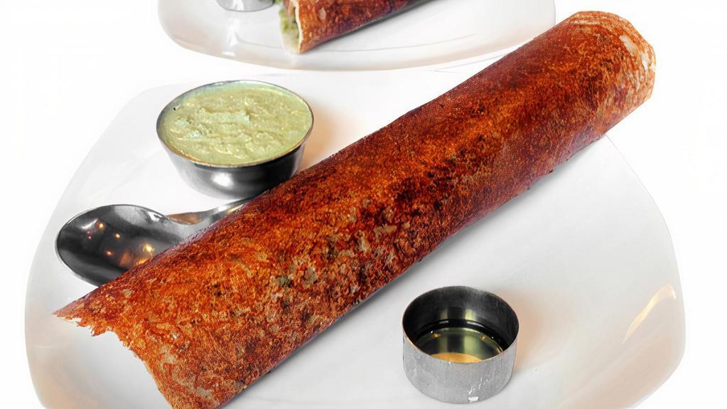 Pondicherry Masala Dosai · Pondicherry special rice and lentil crepe with onions, cabbage, green chilies & spicy sauce.