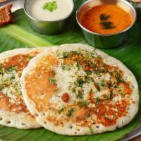 Spinach Dosai · Rice and lentil crepe topped with spinach garlic paste. Nutritional twist for a balanced diet.