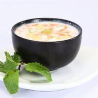 Vegetable Raita · Cool yogurt with onion, cucumber, tomatoes, mint & cilantro.