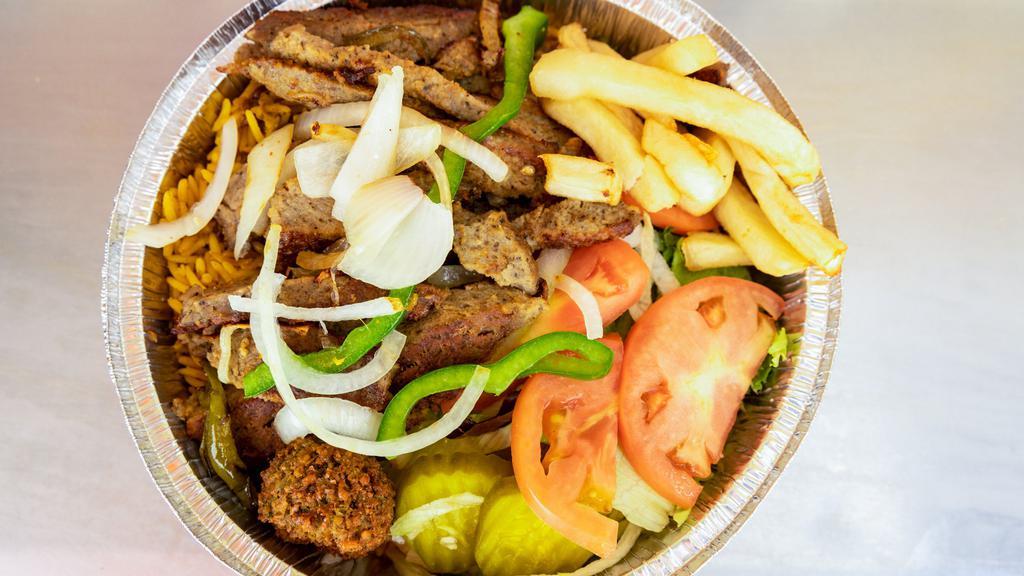 Lamb Gyro Over Rice · Most Popular. Lamb gyro, sliced thin and served over a pile of rice. Served with salad and white sauce.