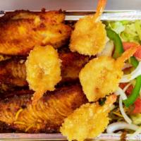 Seafood Combo Over Rice · Talapia fish and jumbo shrimps breaded and fried served over rice with salad and french fries.