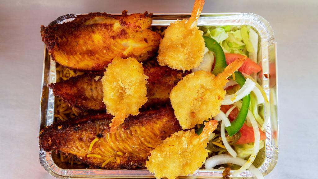 Seafood Combo Over Rice · Talapia fish and jumbo shrimps breaded and fried served over rice with salad and french fries.