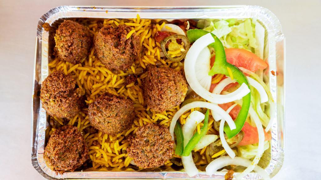 Falafel Over Rice · Vegetarian. Served with rice, salad, and french fries.