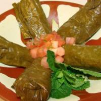 Grape Leaves · Stuffed with rice, onions, parsley, tomato, mint, and special spices, cooked in a mix of oli...