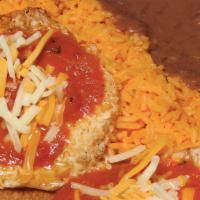 Huevos Rancheros · 2 eggs over crispy tortilla, topped with cheese and homemade tomato sauce. Served with yello...