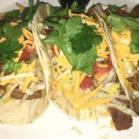 Steak Street Tacos · Soft corn tortilla, white onions and cilantro.