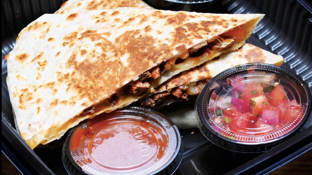 Steak Quesadilla · Made with Jack & cheddar cheese and grilled steak. Plated with sour cream, pico de gallo and salsa.