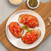 Ola Bruschetta · House baked bread topped with fresh diced tomatoes, garlic, olive oil, sea salt, and parsley.