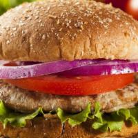 The Turkey Burger · Grilled turkey patty topped on burger buns with lettuce, tomatoes and onions.