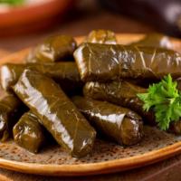 Grape Leaves · Deliciously prepared rolls filled with meat and rice, wrapped with grape leaves. (5 pieces).