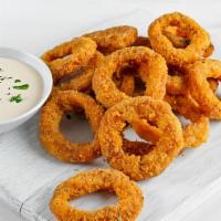 Onion Rings · Golden-crispy onion rings salted to perfection.