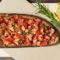 Bruschetta · Toasted bread topped with chopped tomatoes + basil, onions.