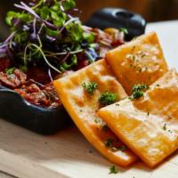 Caponata + Panelle · Baked eggplant  with red peppers, celery, capers, olives, and carrots served with a side of ...