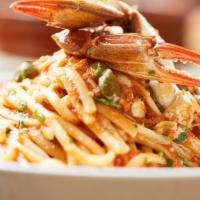 Crab Puttanesca · Blue crab, capers, olives, in tomato sauce over bucatini pasta. Available gluten free. Dairy...