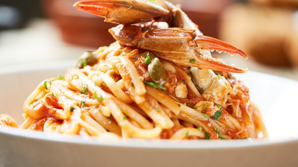 Crab Puttanesca · Blue crab, capers, olives, in tomato sauce over bucatini pasta. Available gluten free. Dairy free.