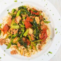 Fusilli Campagnola · Broccoli rabe, spicy Italian sausage and sundried tomatoes in a roasted garlic and oil sauce...