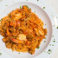 Pasta Emilio · A mellow combination of sausage, shrimp and ham, scallions and diced tomato in a light pink ...