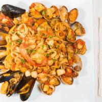 Frutti Di Mare · Mussels, baby clams, calamari, scungilli, shrimp, plum tomato marinara sauce, over linguine.