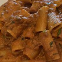 Rigatoni Bolognese · Braised veal and beef in a rich tomato sauce.