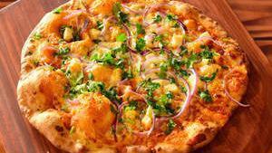Phenomenaan (Indian) · Makhani, mozzarella, paneer, onion, ginger, cilantro.