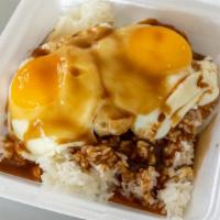 Loco Moco · 2 scoops of rice, 1 homemade Tatsuo’s hamburger patty, 2 eggs any style, with savory brown g...