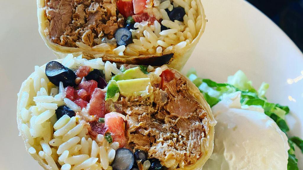 The O.G. · our pulled pork carnitas stuffed with yellow rice, black beans, pico de gallo, avocado and chipotle mayo