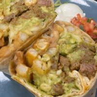 Socal · grilled carne asada, oaxaca cheese, refried beans and guacamole stuffed with fries