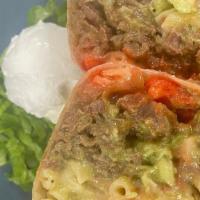 Hot Cheeto Cheesesteak · carne asada loaded with our spicy queso mac, flamin' hot cheetos, caramelized onions and fre...