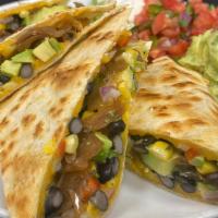 Roasted Corn & Black Bean · made with cheddar and monterey jack, loaded with caramelized onions and sliced avocado