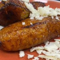 Fried Plantains · topped with queso fresco, served with sour cream