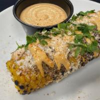 Elote · seasoned mexican sreet corn finished with cotija, cilantro and lime, served with chipotle mayo