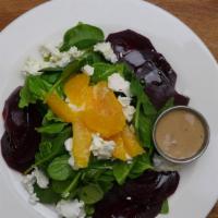 Roasted Beet Salad · Roasted beets, baby spinach, goat cheese, sliced oranges and honey balsamic.